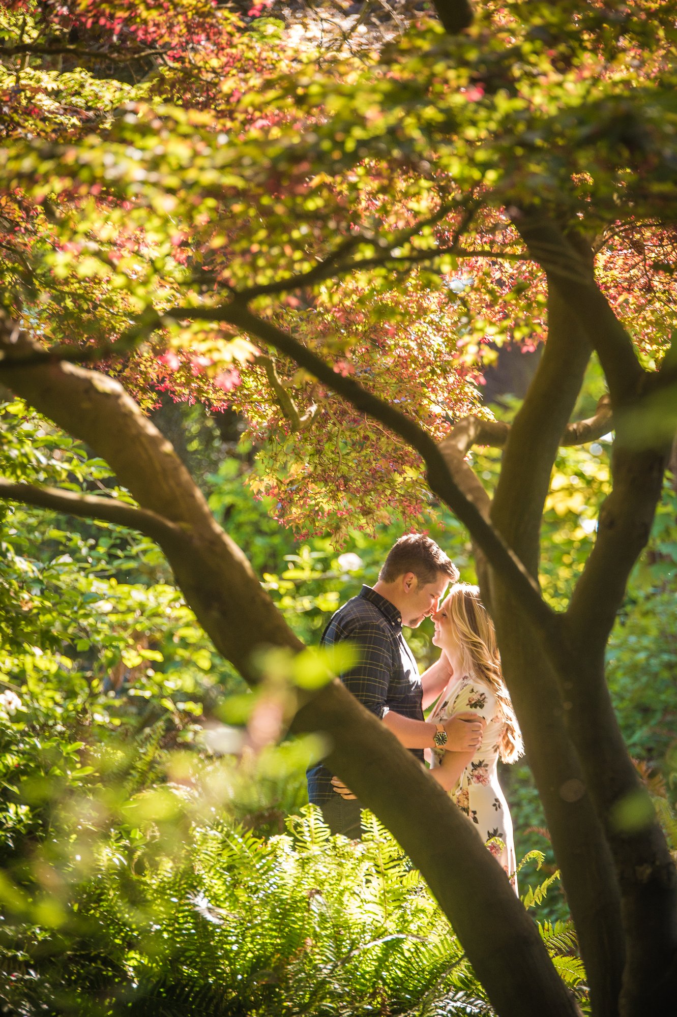 Alik and Amanda together during their engagement session at Beacon Hill Park in Victoria