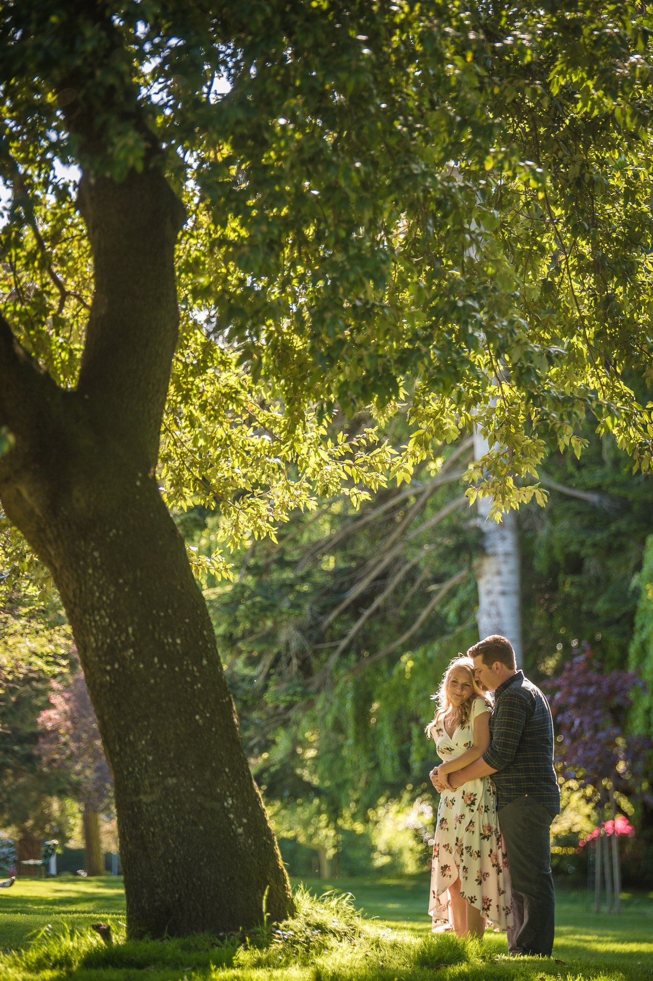 Alik and Amanda together during their engagement session at Beacon Hill Park in Victoria