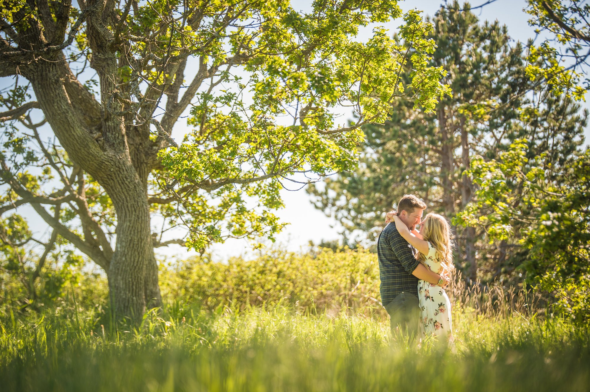 Alik and Amanda together during their engagement session at Beacon Hill Park in Victoria