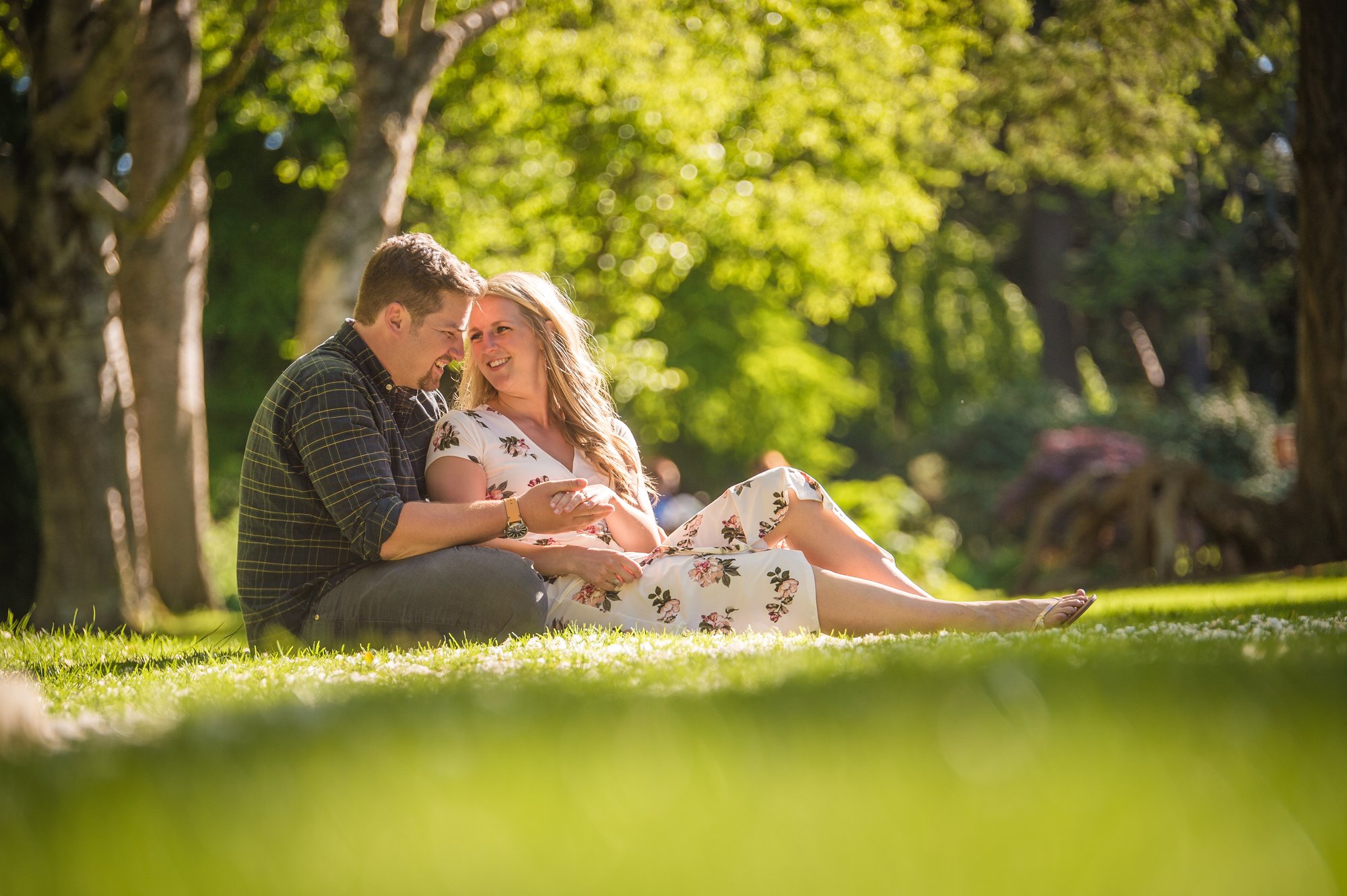 Alik and Amanda together during their engagement session at Beacon Hill Park in Victoria