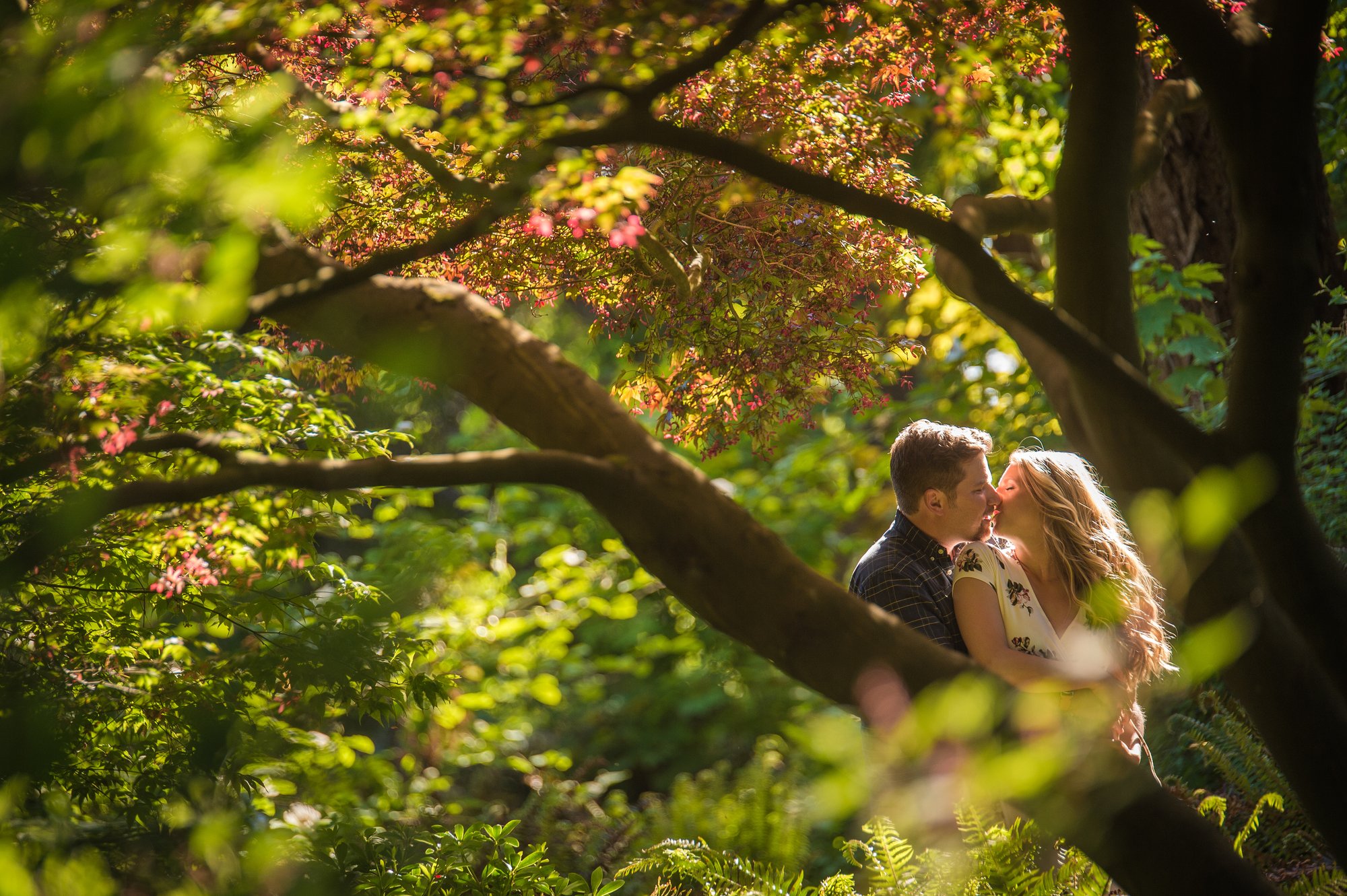 Alik and Amanda together during their engagement session at Beacon Hill Park in Victoria