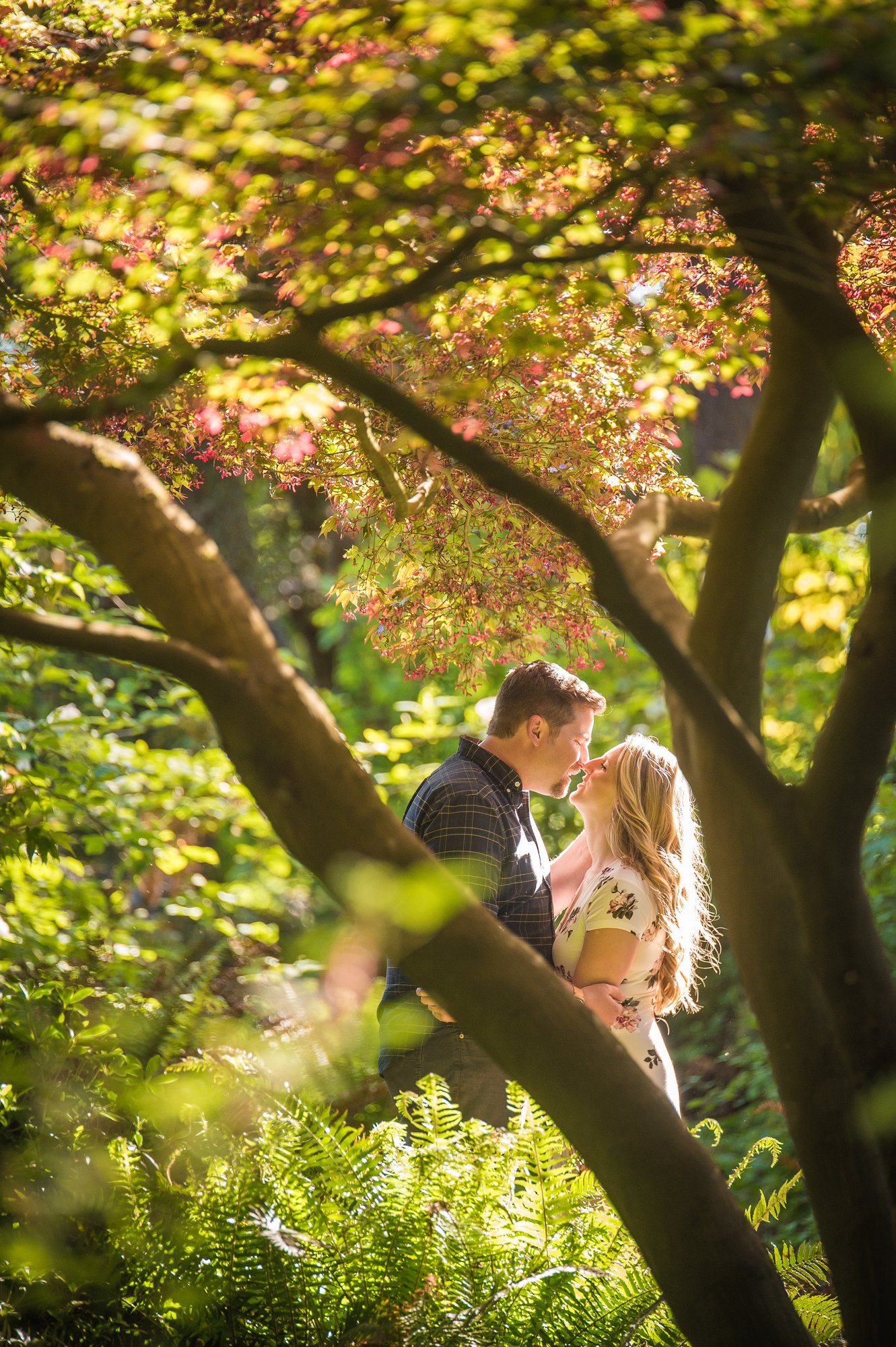 Alik and Amanda together during their engagement session at Beacon Hill Park in Victoria
