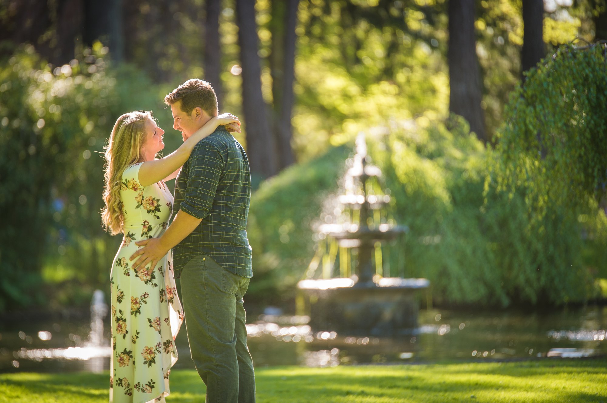 Alik and Amanda together during their engagement session at Beacon Hill Park in Victoria